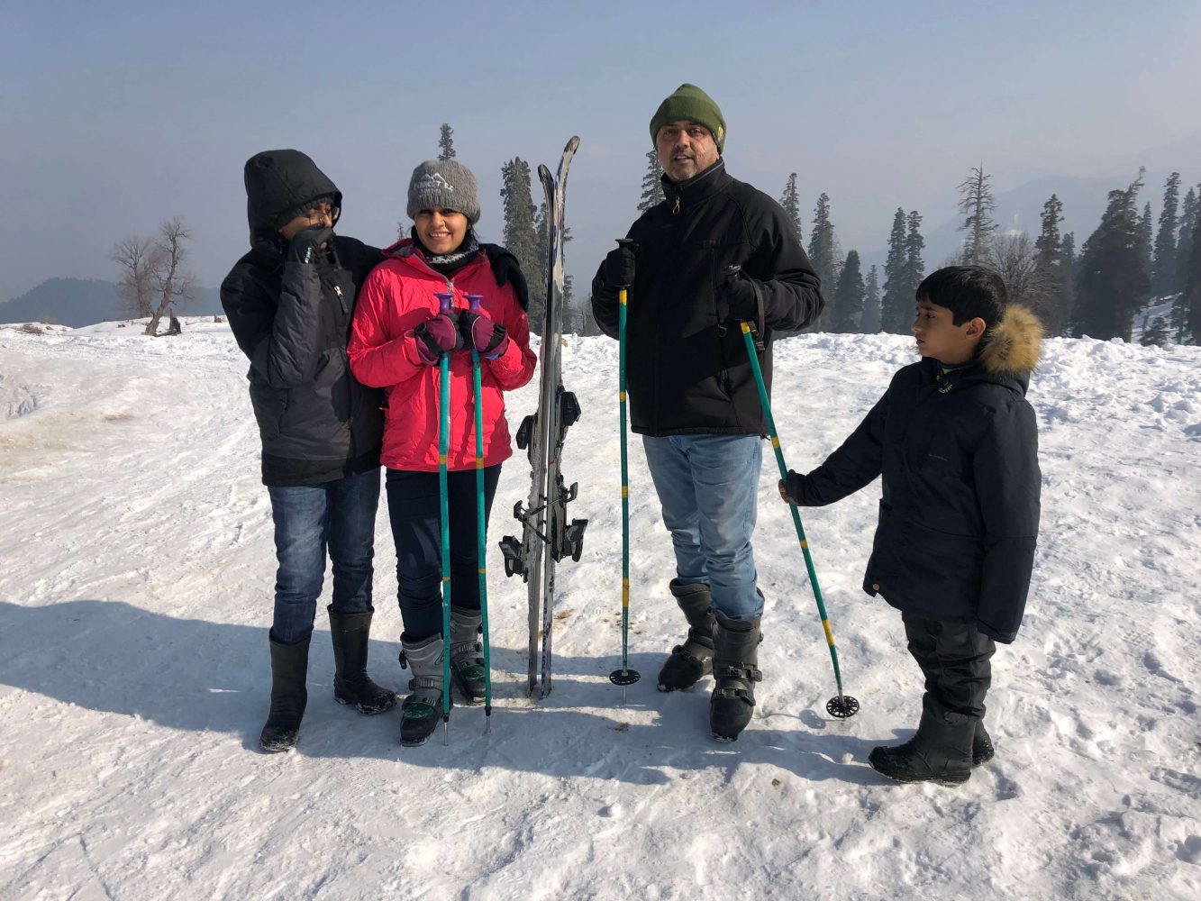 Family sharing skiing experiences together on a vacation